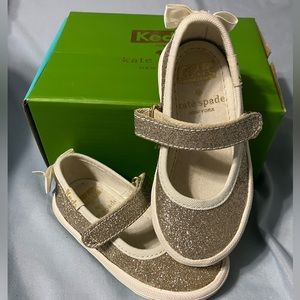 Used little girls sparkling gold keds/Kate Spade dress shoes, size 5.